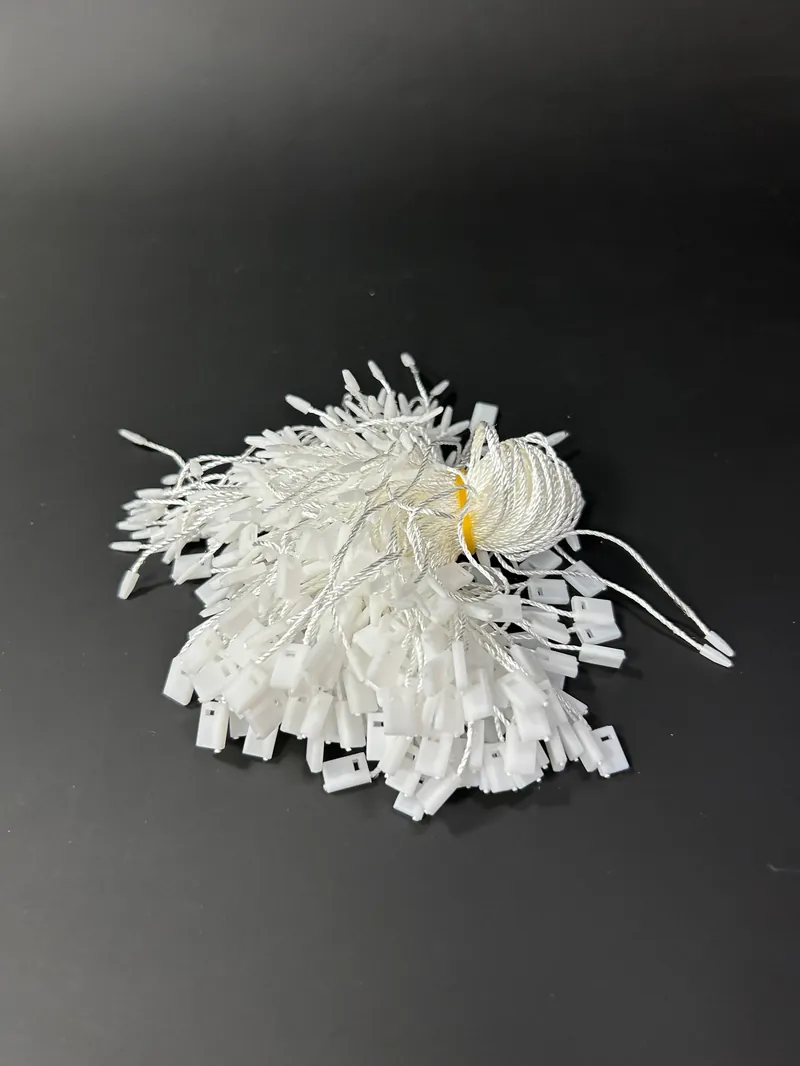 Веревочные биркодержатели белые (100 шт. в упаковке) Веревочные биркодержатели белые (100 шт. в упаковке)